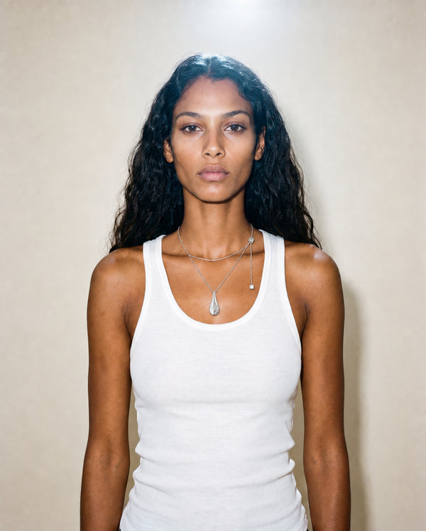 model wearing a teardrop resin and silver and set with lab grown diamonds