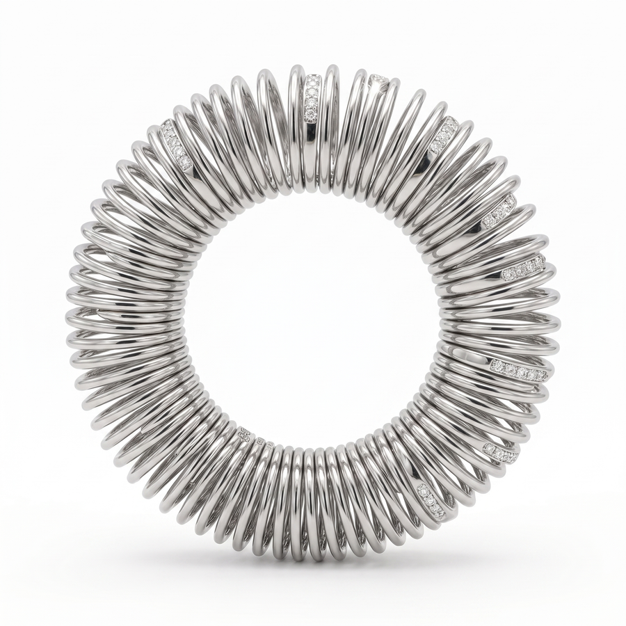 A silver circular bangle featuring a coiled, spring-like design with small inset lab-grown diamonds along the upper outer edges, photographed on a clean white background.